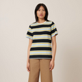 A person standing against a neutral background, wearing a striped short sleeve shirt with a ribbed crew neck and long pants.