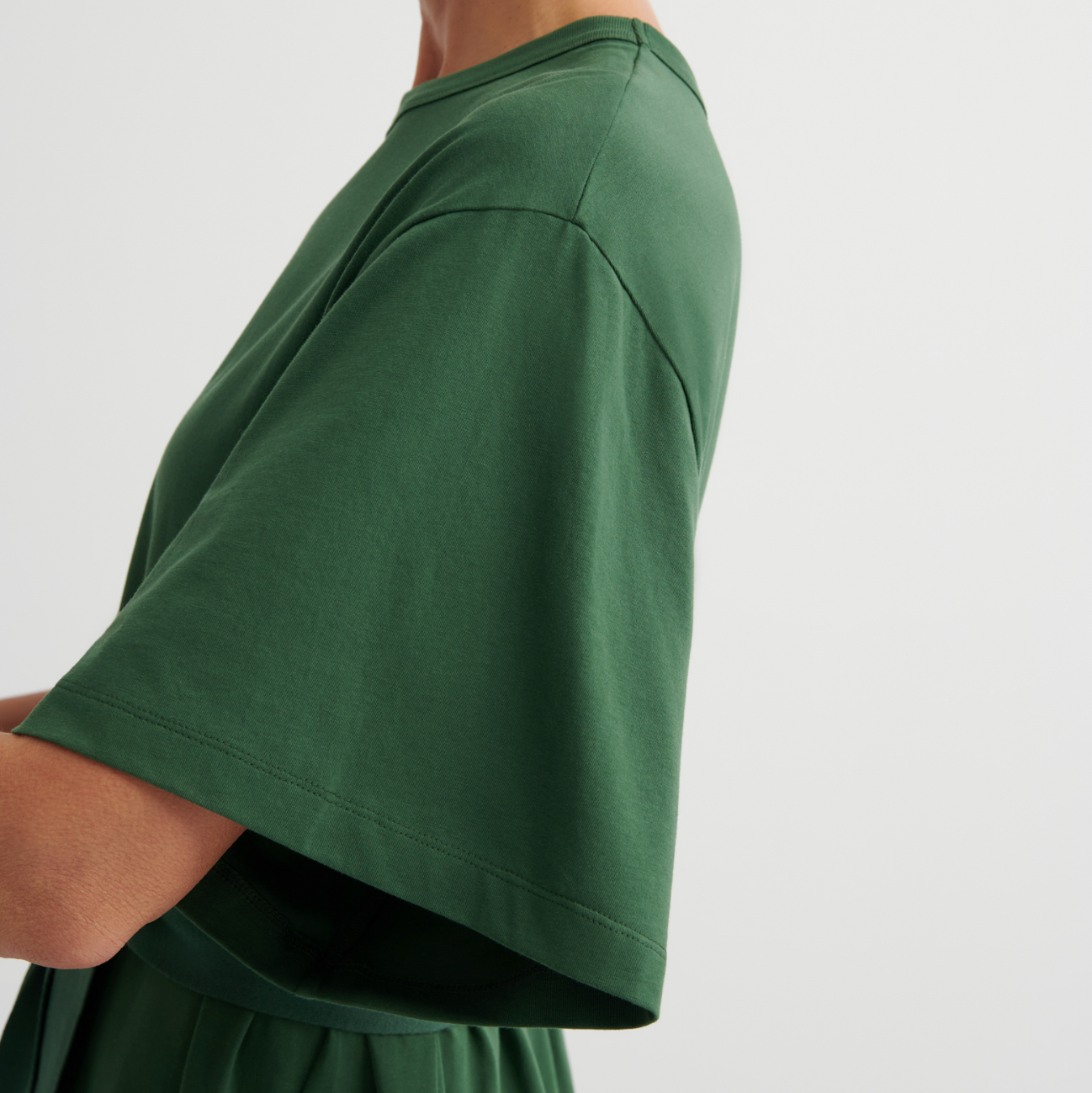 Green dress with a plain background