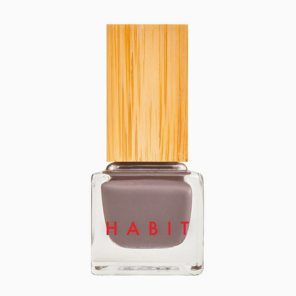 Nail polish bottle with wooden cap on a white background