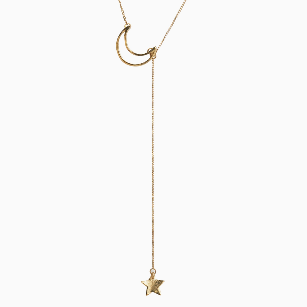 Gold necklace with a crescent moon and star pendant on a white background